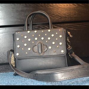 Black purse embellished with pearls